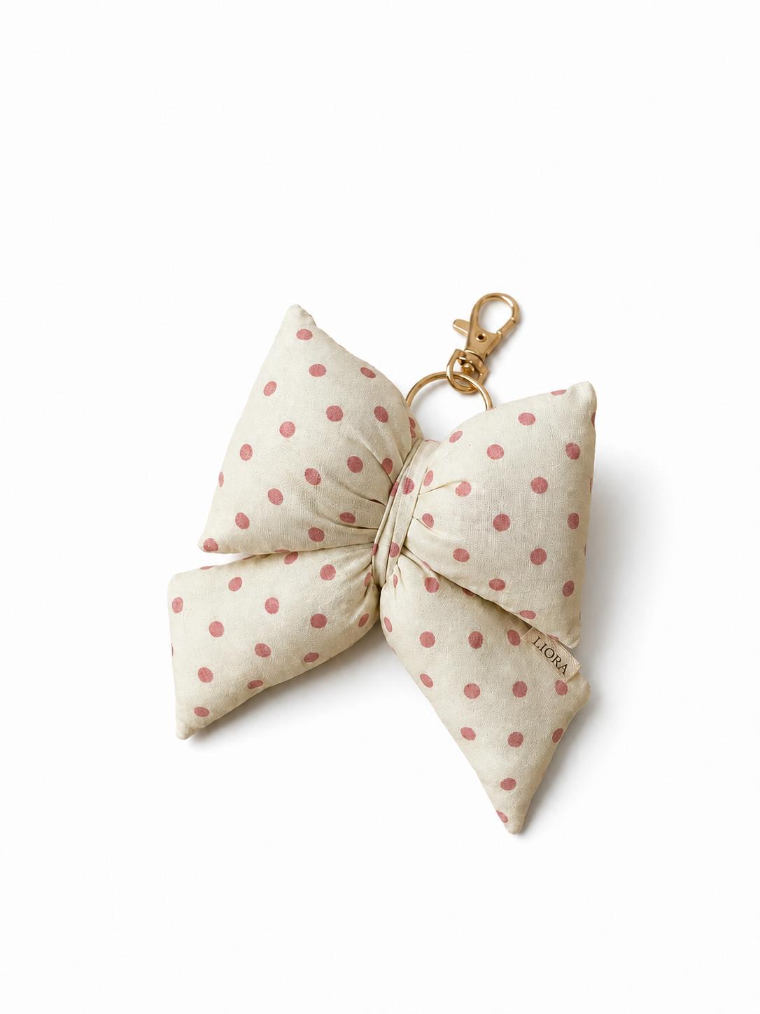 Colette Bubble Bow mit rosa Punkten auf weißem Hintergrund